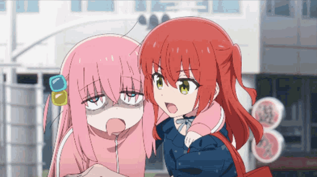 a girl with pink hair and a red haired girl with green eyes are standing next to each other