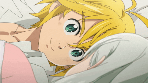 a cartoon character with blonde hair and green eyes is laying on a bed