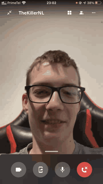 a man wearing glasses is on a video call with the name thekillernl on the screen