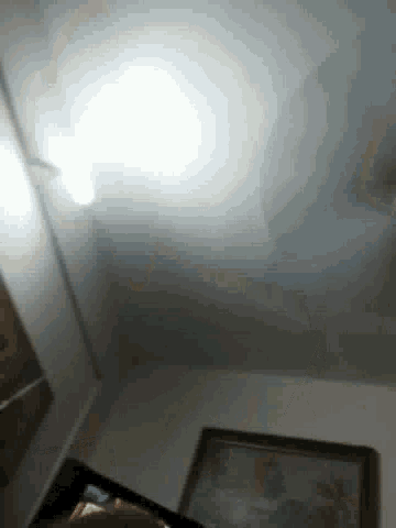 a white light is shining on a table in a room