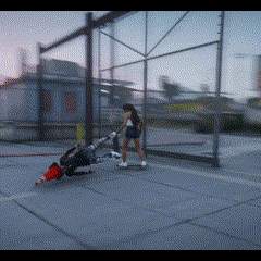 a blurry picture of a person riding a skateboard on a sidewalk