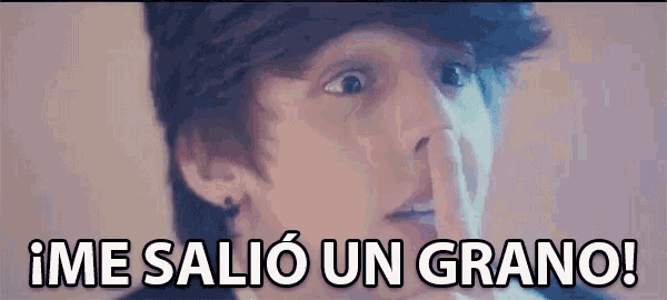 a close up of a person 's face with the words me salio un grano written on the bottom