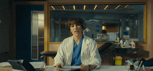 a woman in a lab coat has a name tag that says alonso