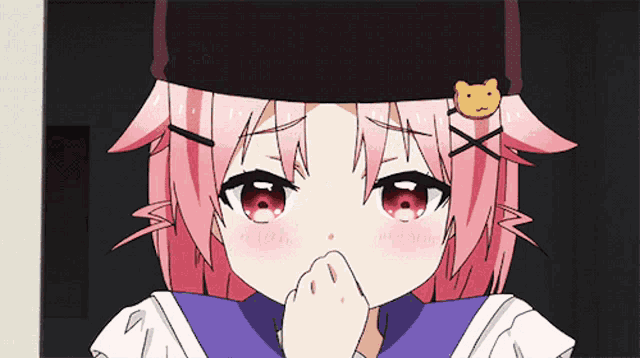 a girl with pink hair and a black hat with a cat on it