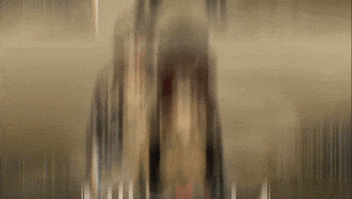 a blurred image of a person 's face with a few lines in the background