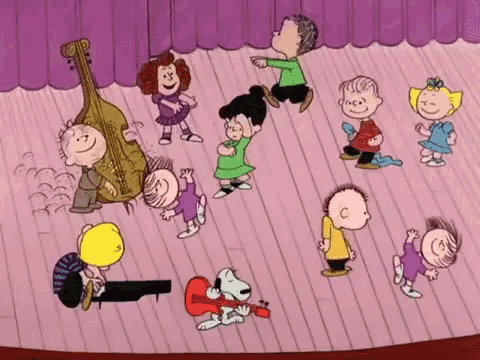 a group of cartoon characters are dancing on a stage