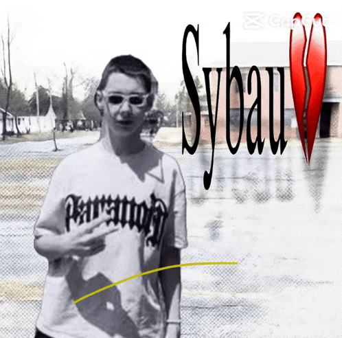 a person wearing a t-shirt that says sybau