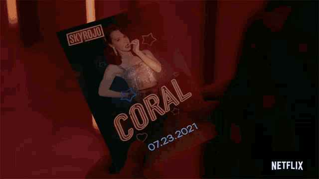 a person is holding a poster that says skyrojo coral on it