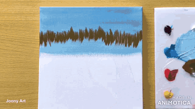 a painting on a canvas next to a made in animotica palette