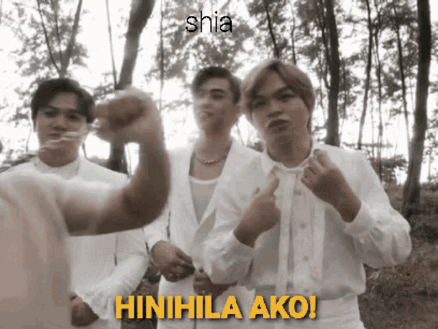a group of men in white shirts are standing in a forest and the caption says shia hinihinla ako