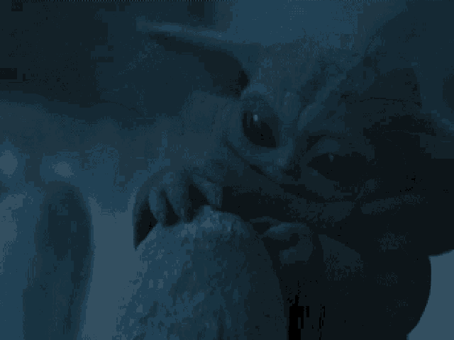 a close up of a stuffed animal with big eyes
