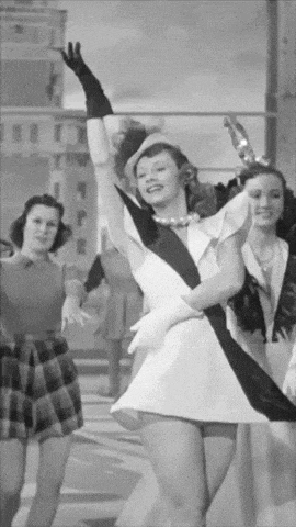 a black and white photo of a woman dancing