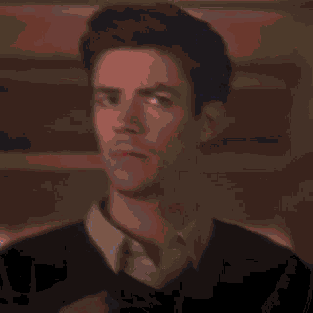 a green background with a blurred image of a person 's face