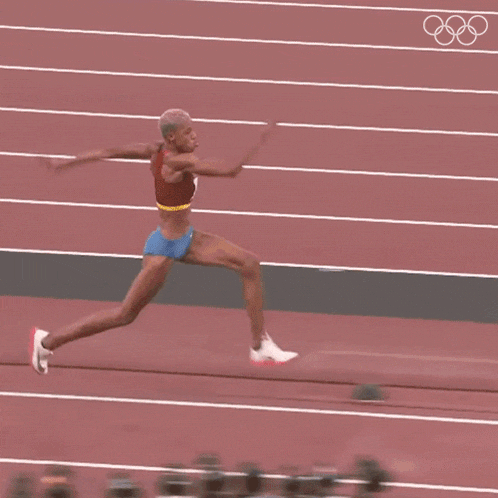 a runner on a track has the number 16 on her shirt
