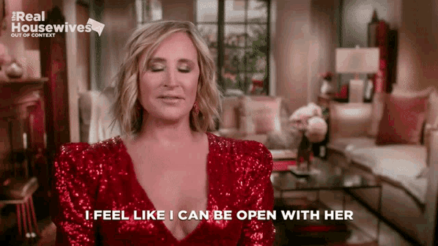 a woman is wearing a red sequined dress and says i feel like i can be open with her