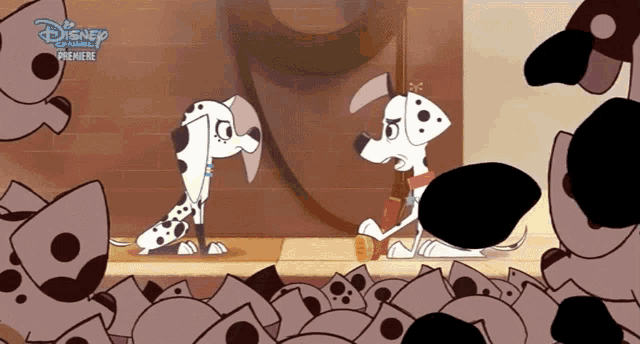 two dalmatian dogs are standing next to each other with a disney channel logo in the background