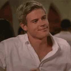 a close up of a man wearing a white shirt .