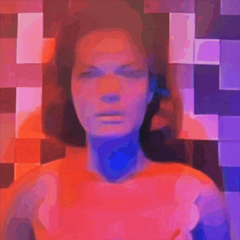 a woman in a bra is standing in front of a purple and red background .