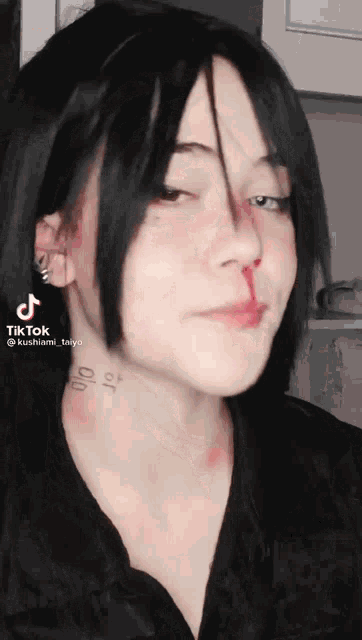 a woman with a bloody nose has a tattoo on her neck that says ' 00 '