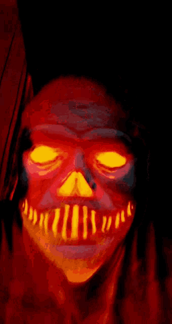 a painting of a skull with glowing eyes