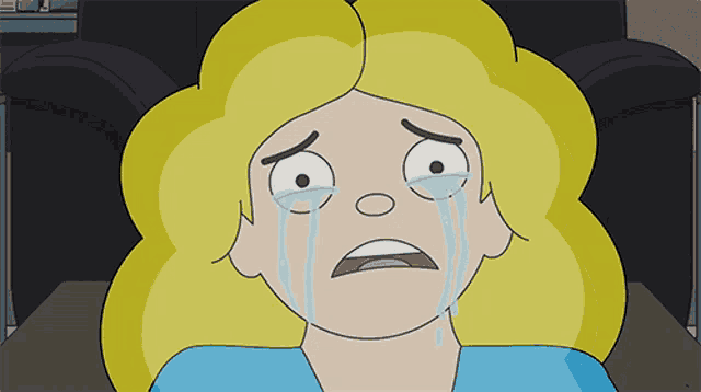 a cartoon woman with blonde hair is crying with tears running down her face
