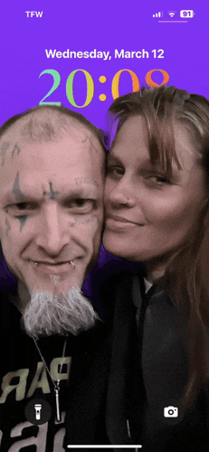a couple posing for a picture on wednesday march 12 at 20:00
