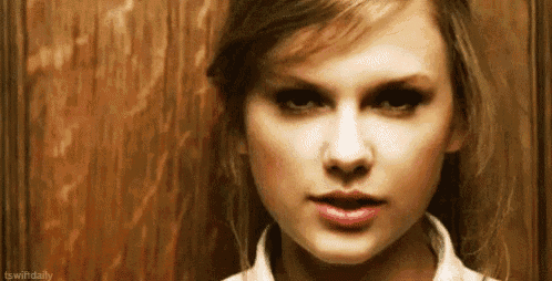 a close up of a woman 's face with a serious look on her face .