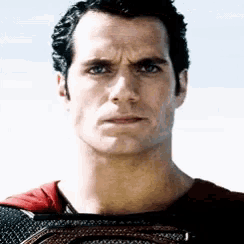 a close up of a man 's face with a serious look on his face .