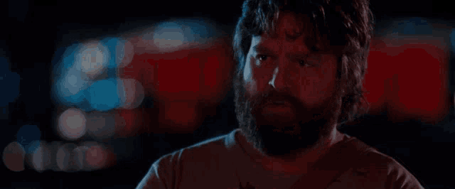 a man with a beard is running around the desert together in las vegas looking for strippers and cocaine