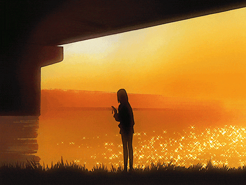 a silhouette of a person looking out over a body of water