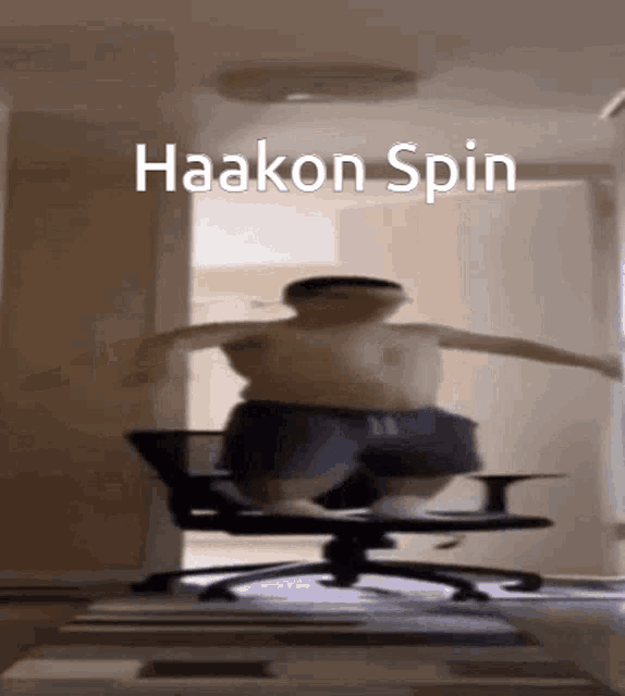 a blurry picture of a person jumping in the air with the words haakon spin below them