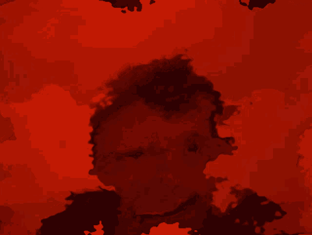 a red background with a silhouette of a man