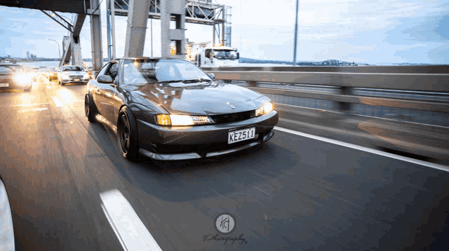 a car with a license plate that says ke2514 is driving on a highway