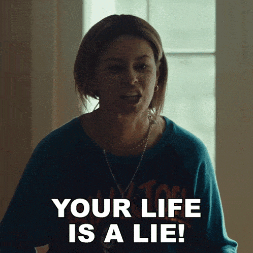 a woman says your life is a lie while wearing a blue shirt