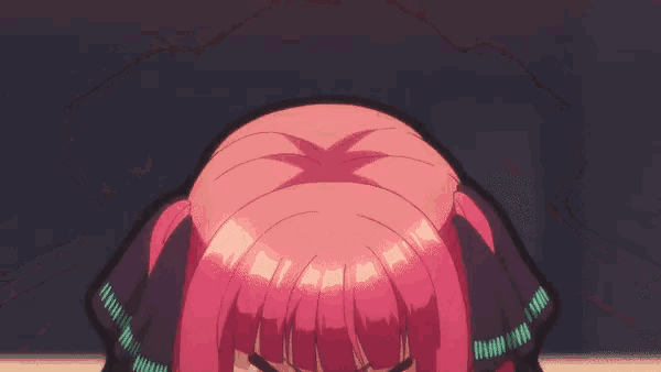a girl with pink hair is making a funny face with her eyes closed
