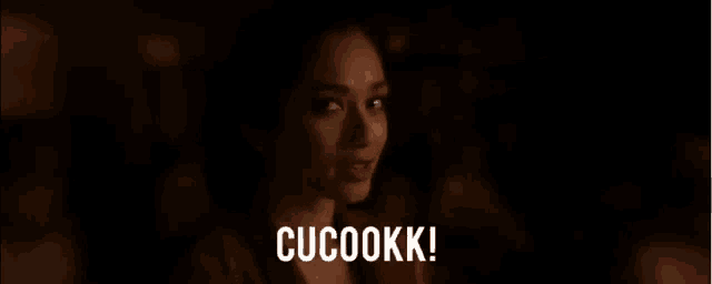 a close up of a woman 's face with the words cucookk written on the bottom .