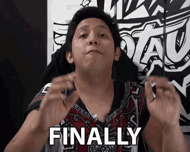a man says finally in front of a sign