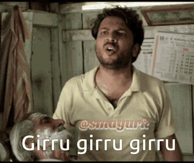 a man with a beard wearing a shirt that says girru girru girru on it