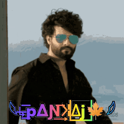 a man wearing sunglasses and a black shirt stands in front of a sign that says pandaj