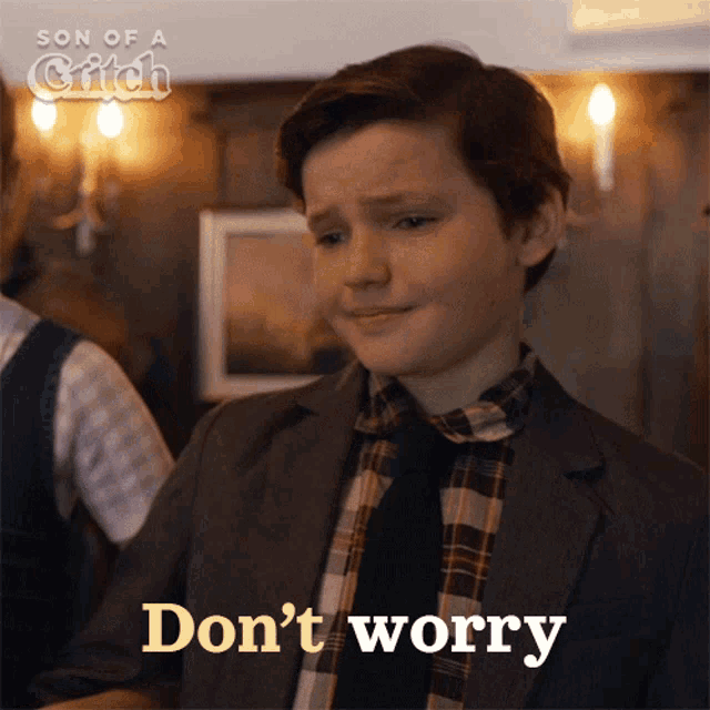 a young boy in a suit and tie says " don 't worry "
