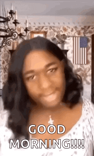 a woman is making a funny face and saying `` good morning '' .