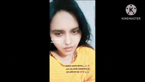 a woman 's face is shown on a screen with a watermark that says kinemaster on it