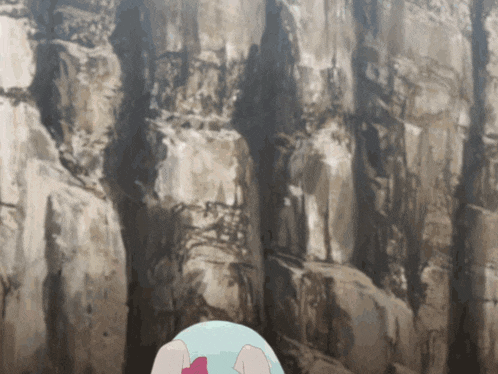 a cartoon character is standing in front of a rocky cliff