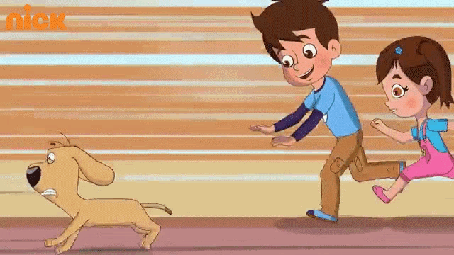 a boy and a girl are running with a dog .