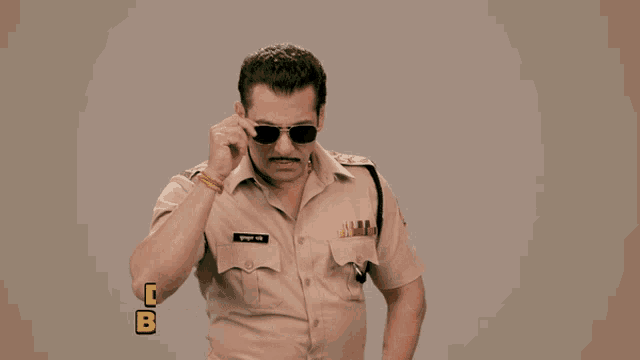 a man in a police uniform has the words darte toh hum apne baap se bhi nahi hain above him