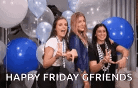 three women are posing for a picture in front of balloons .
