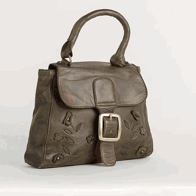 a brown leather purse with a gold buckle