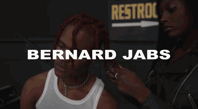 a man with red hair is wearing a choker and the words bernard jabs are on the screen