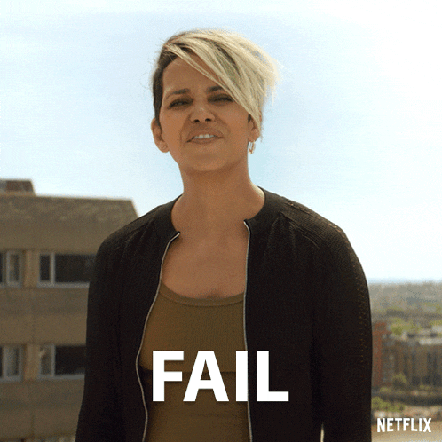 a woman stands in front of a building with the word fail above her