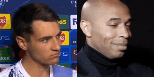 a man in a white shirt and a man in a black suit are making funny faces